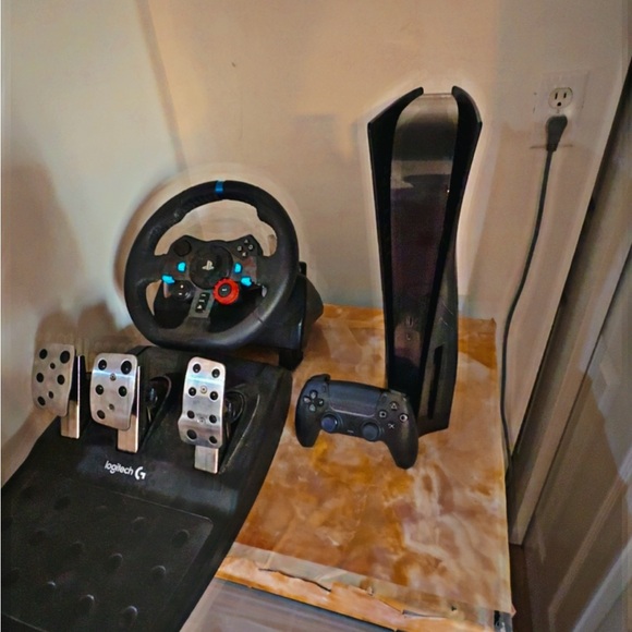 Ps5,with black controller and gaming wheel and game for the gaming wheel